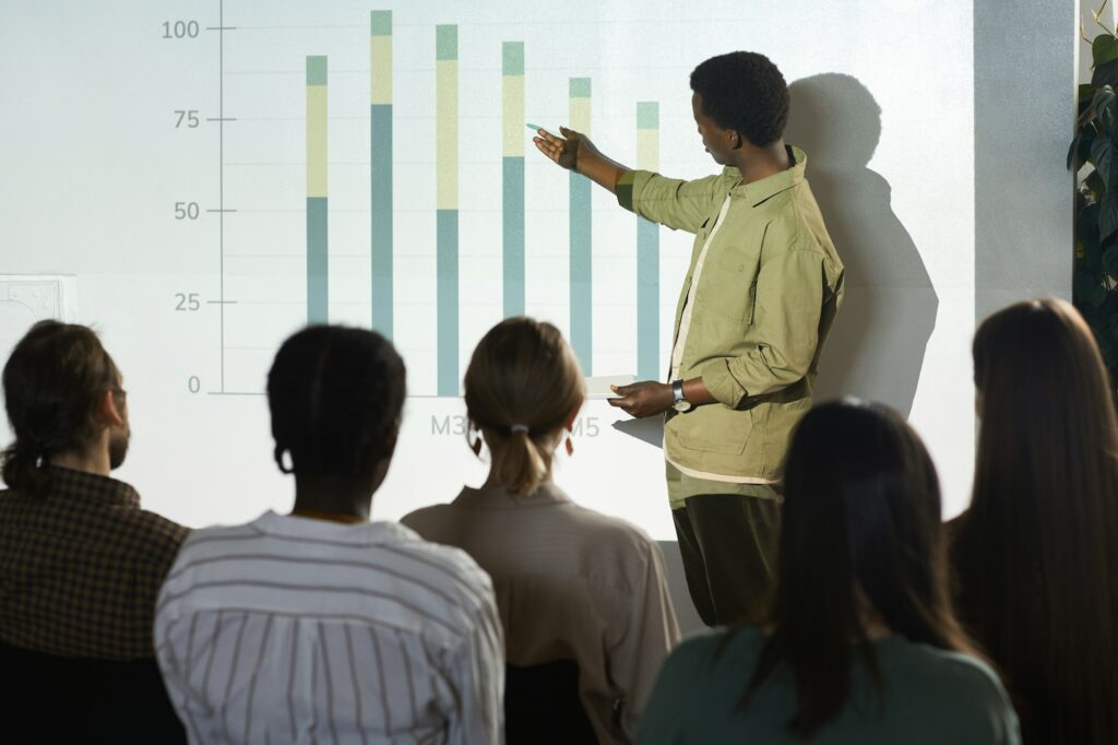 African Man Presenting at Business Conference