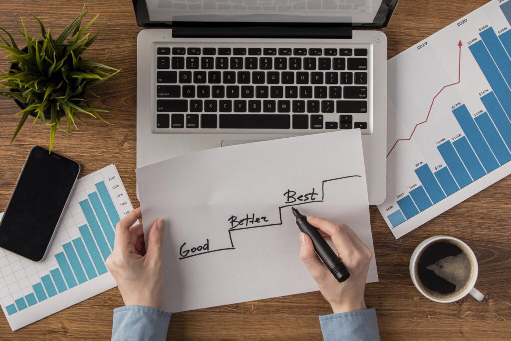 man holding marker over sheet of paper with steps of success. why a content plan is crucial for Beverly businesses